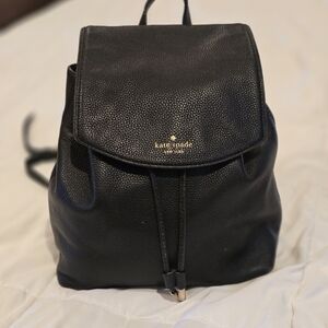 kate spade Black Pebbled Leather Flap Backpack with Gold Logo